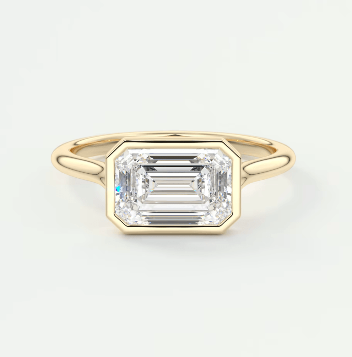 18k yellow gold emerald cut diamond engagement ring.