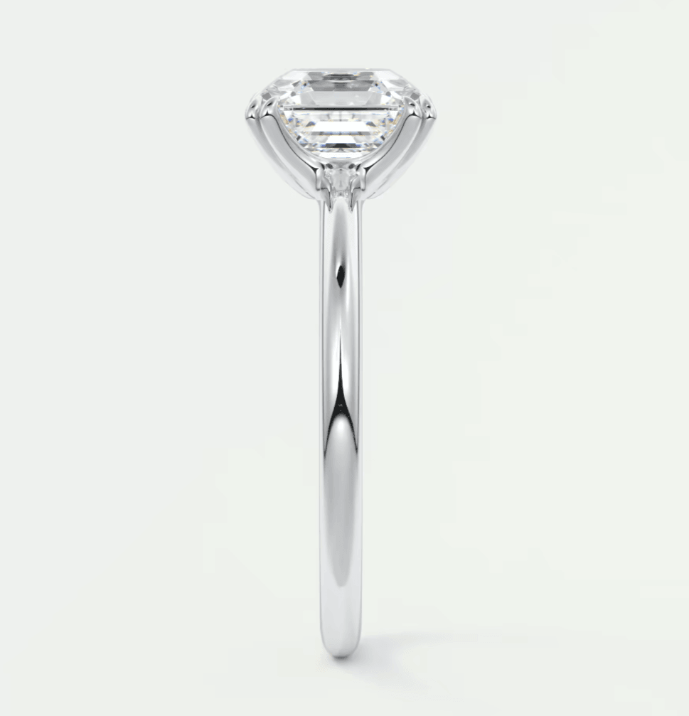 18-karat white gold engagement ring with a princess-cut diamond.