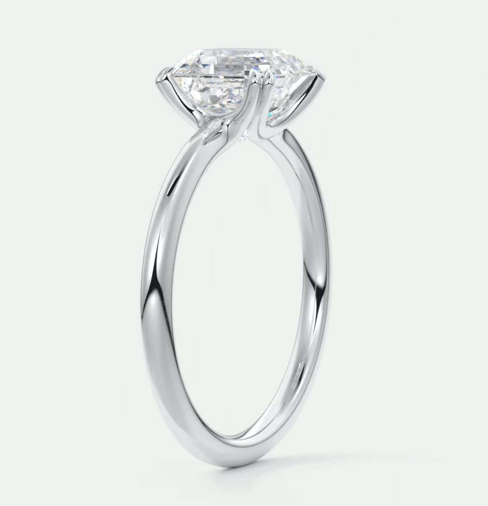 18-karat white gold engagement ring with a princess-cut diamond.