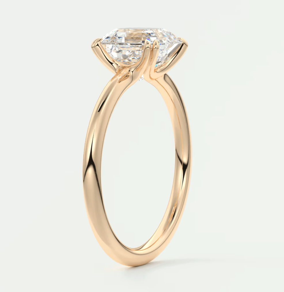 18k yellow gold engagement ring with a marquise-cut diamond.