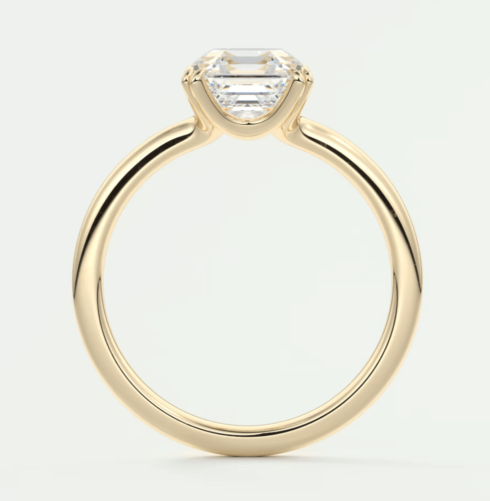 18k yellow gold engagement ring with a princess cut diamond.