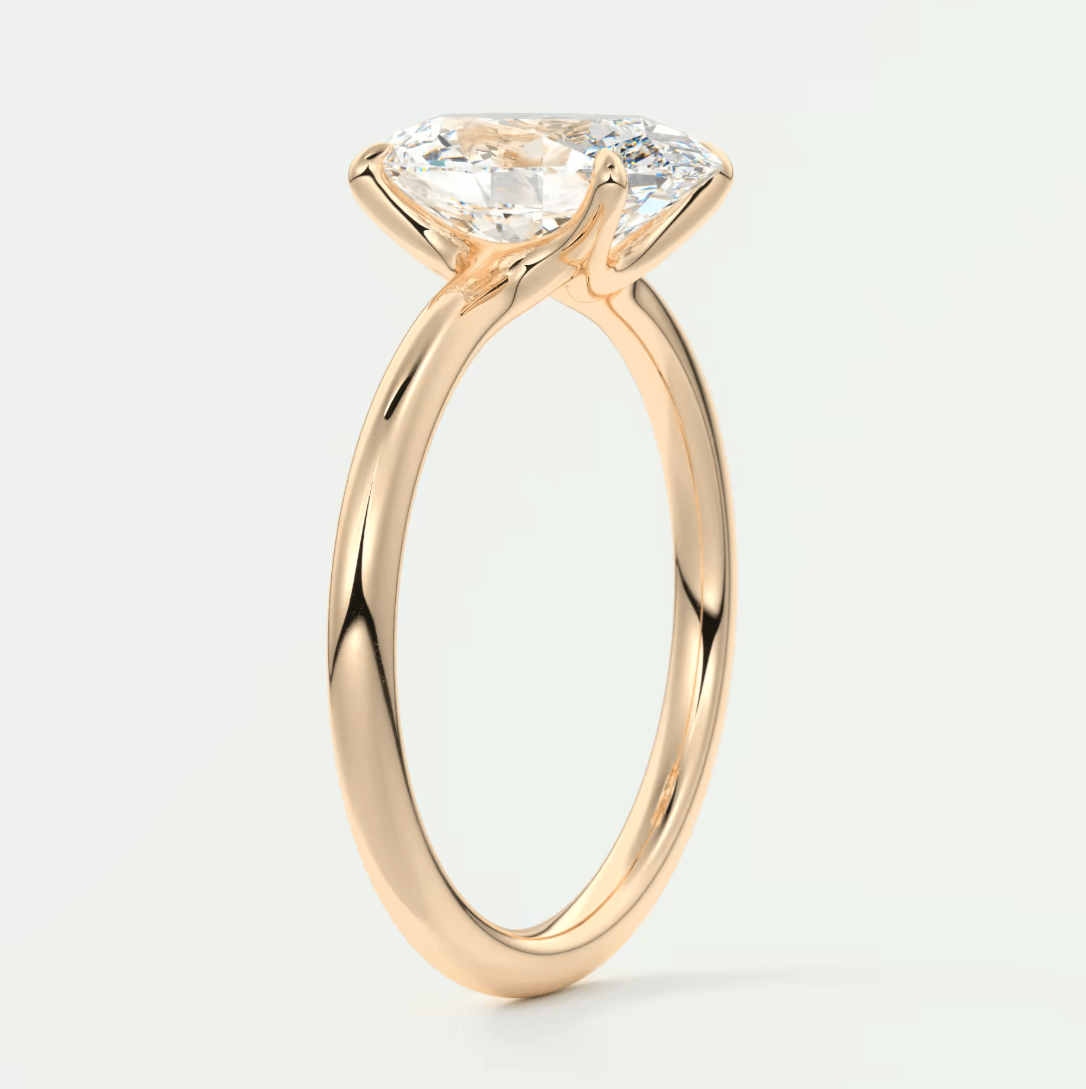 Rose gold engagement ring with a large, cushion-cut diamond.
