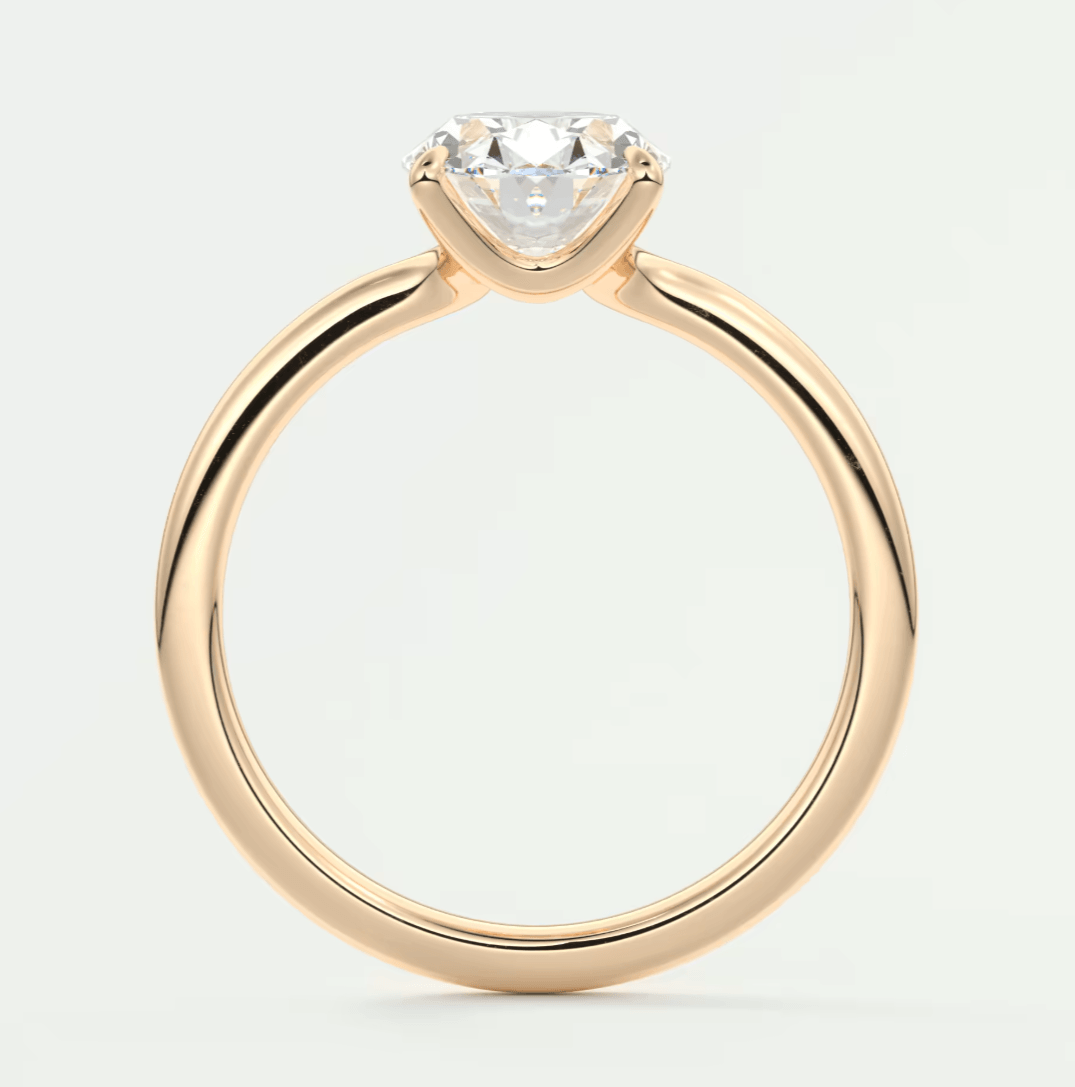 18k gold solitaire diamond engagement ring with a princess cut stone.