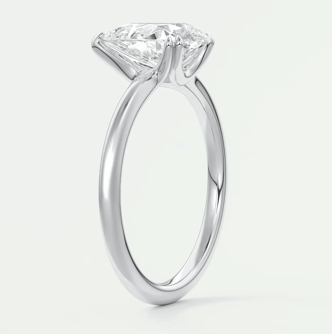 18-karat white gold engagement ring with a princess-cut diamond.
