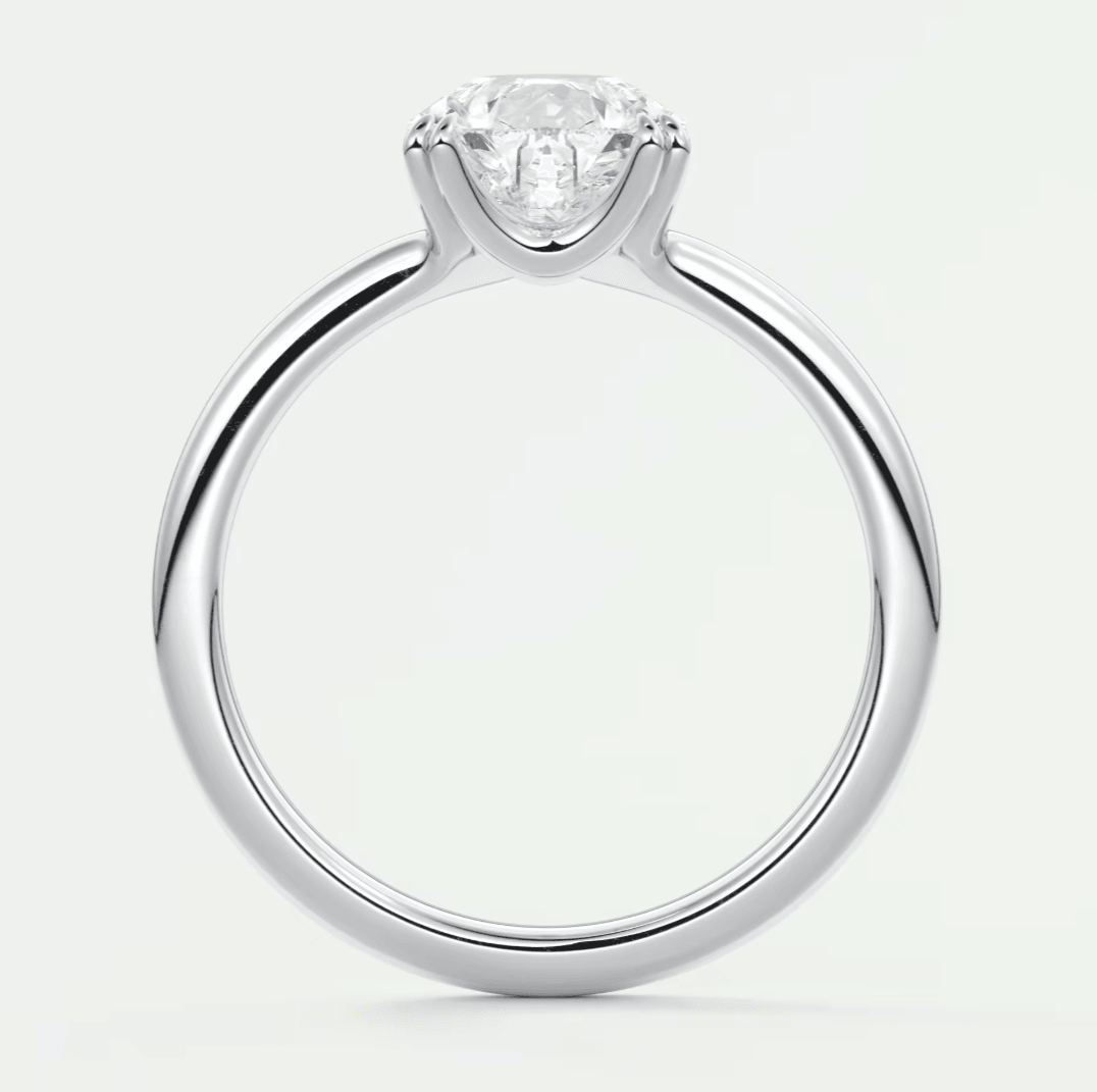 18k white gold solitaire diamond engagement ring.