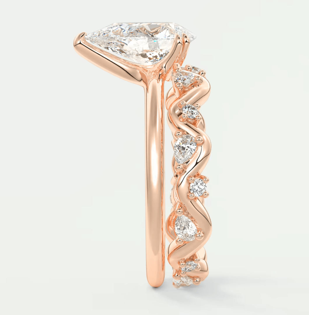 Rose gold diamond engagement ring set with twisted band design and princess cut center stone.