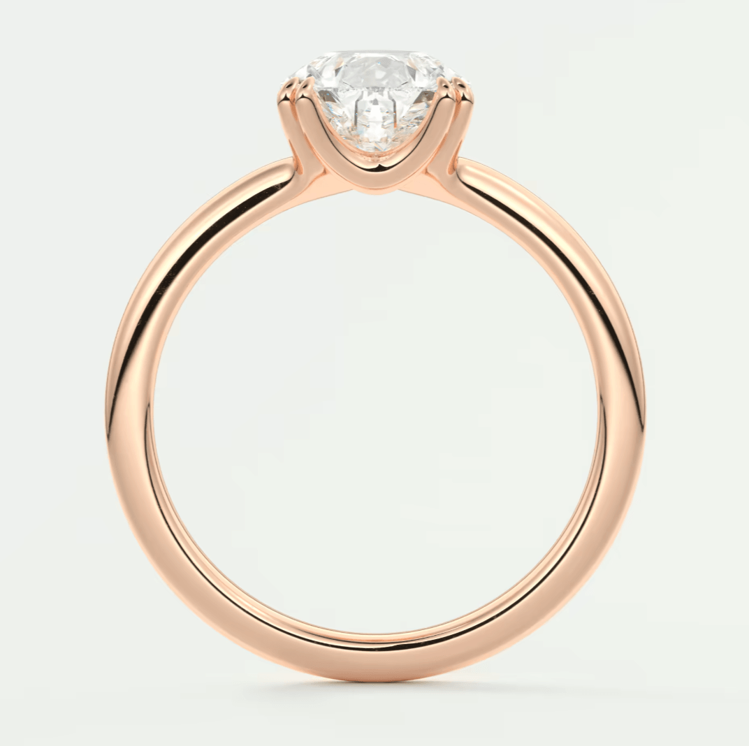Rose gold diamond engagement ring with a solitaire design and prong setting.