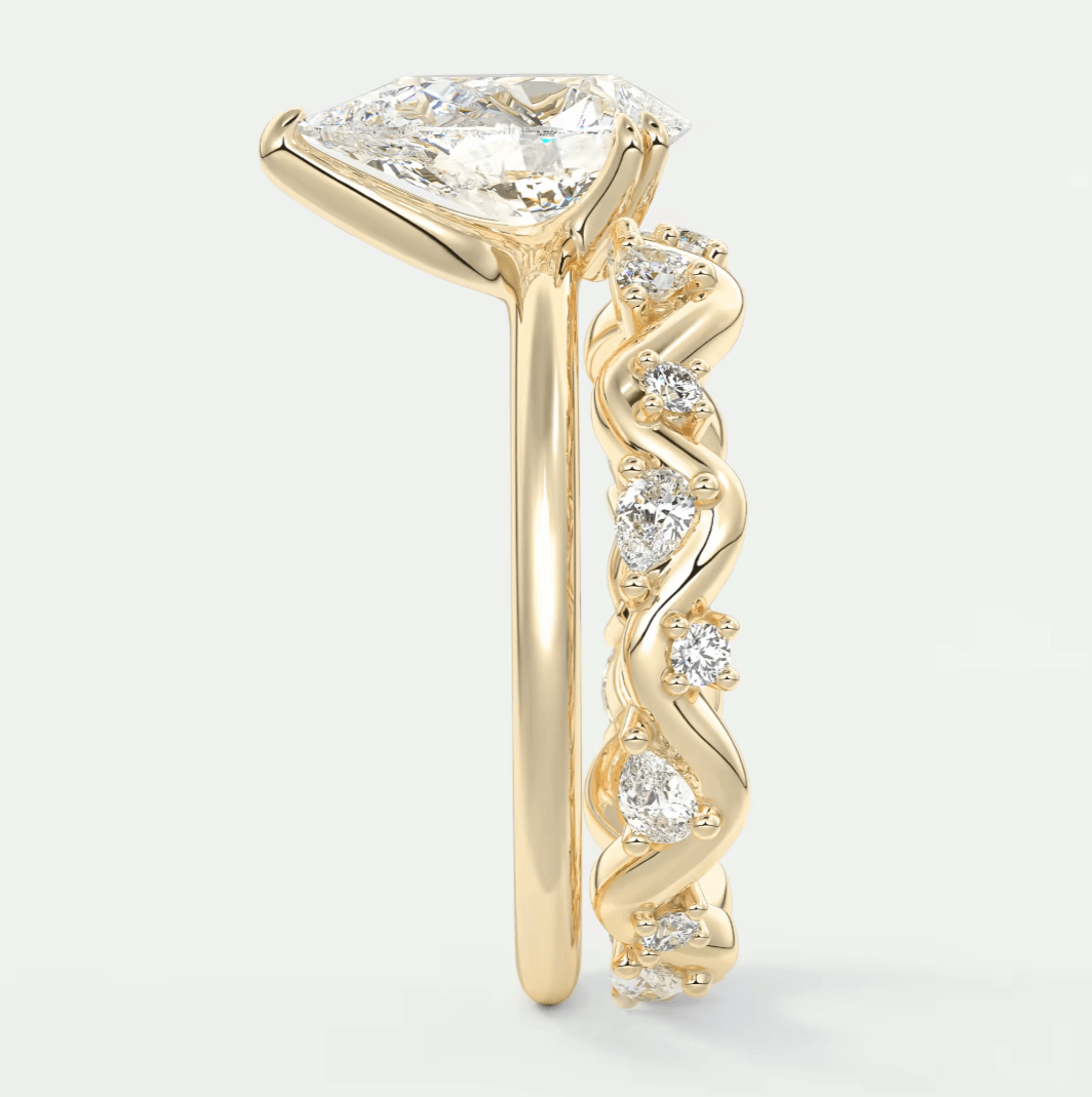 18k yellow gold engagement ring with a princess cut diamond and small diamonds set in the band.