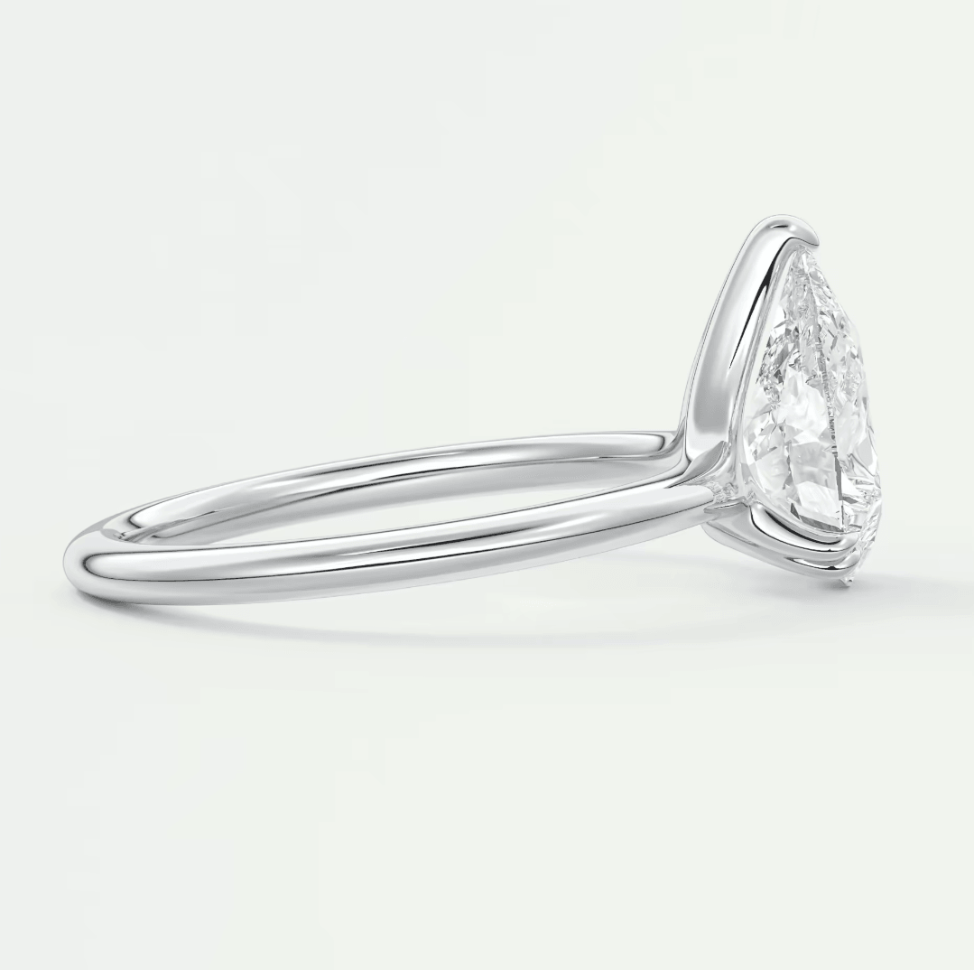 18k white gold pear-shaped diamond engagement ring.