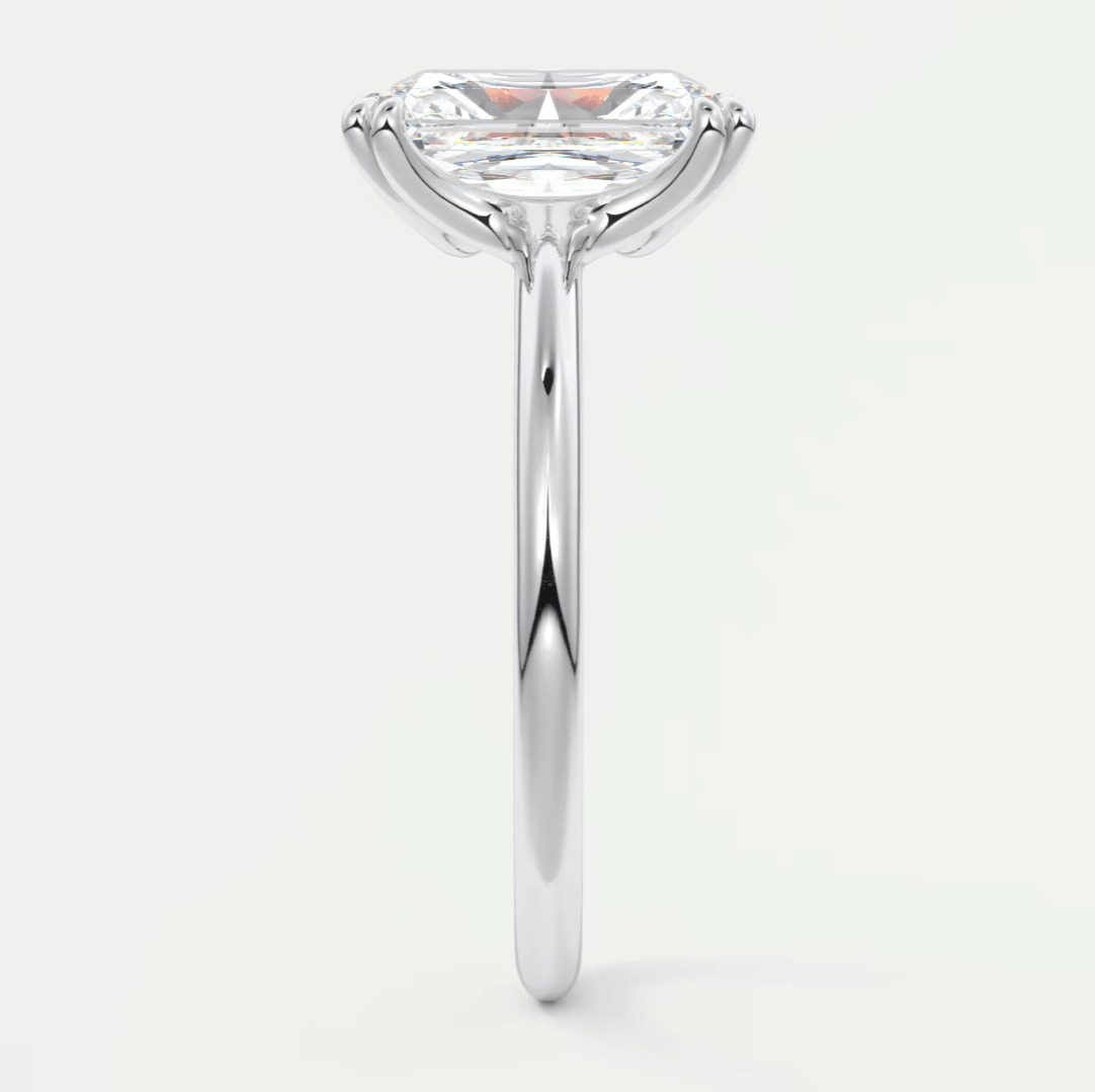 18-karat white gold solitaire engagement ring with a princess-cut diamond.