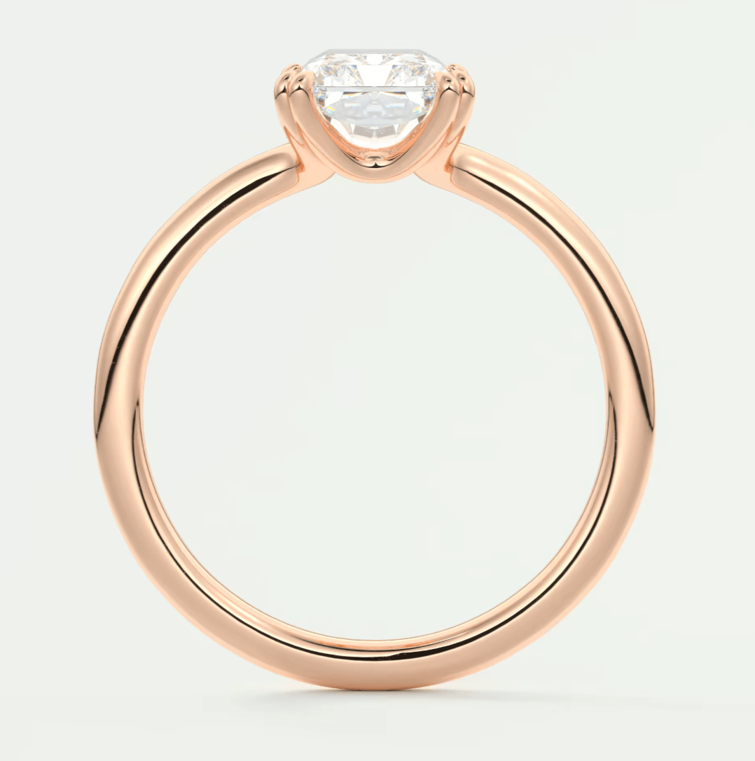 Rose gold engagement ring with a princess cut diamond.