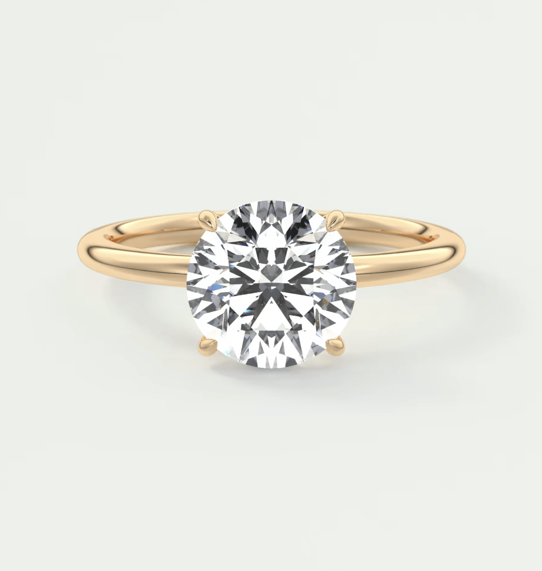 14k yellow gold solitaire diamond engagement ring.