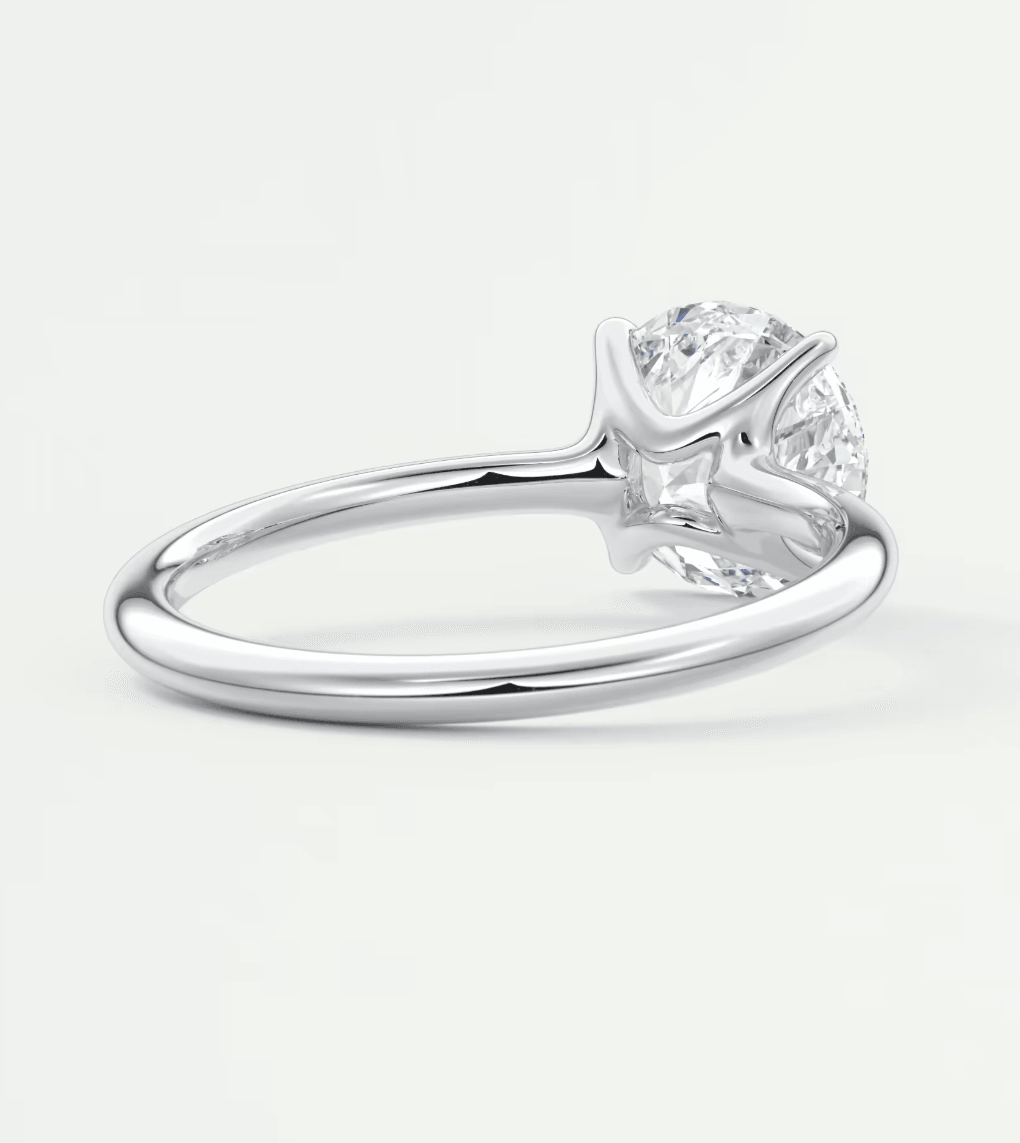 18k white gold solitaire diamond engagement ring with a round brilliant cut gem.