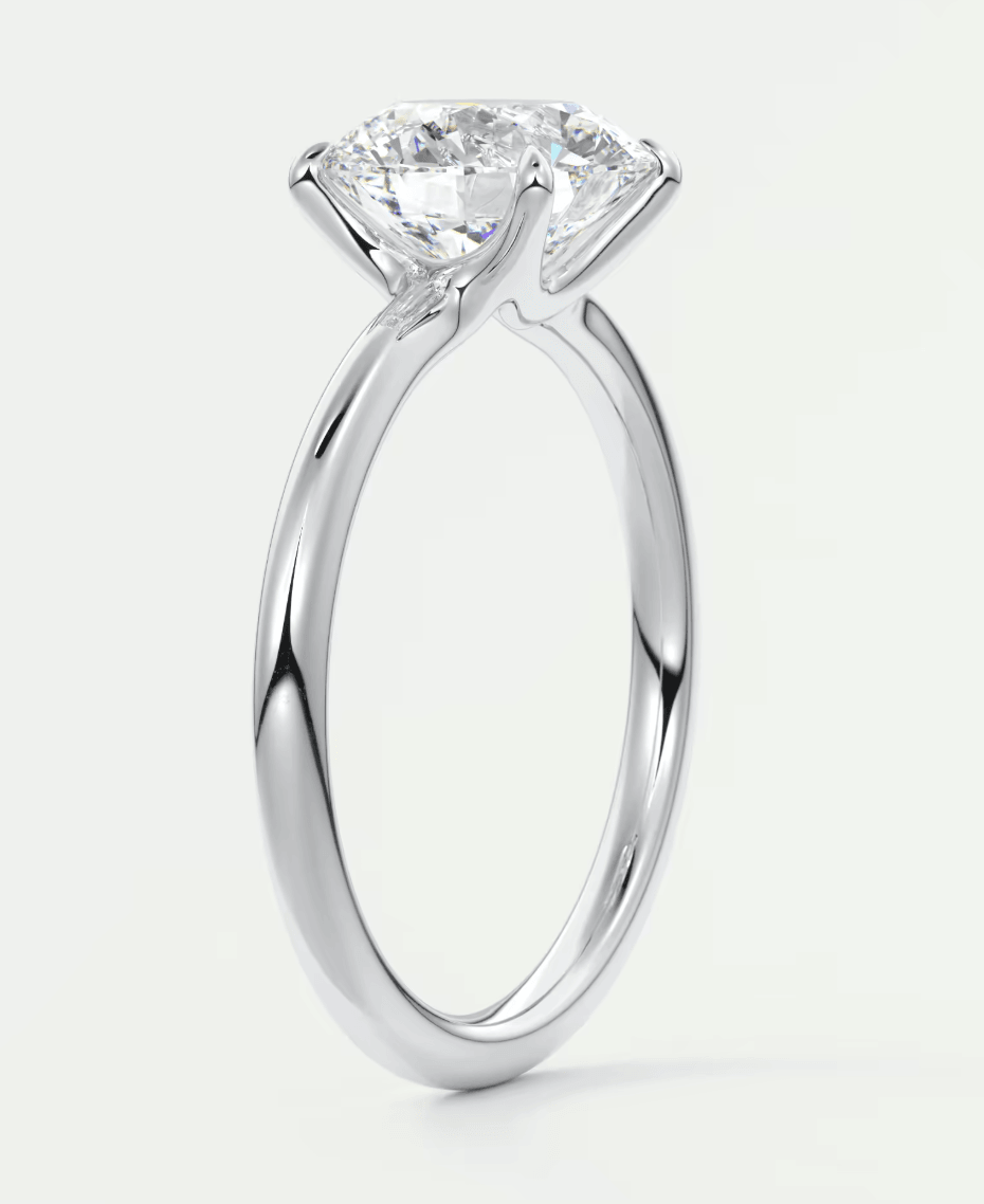 18-karat white gold solitaire diamond engagement ring.