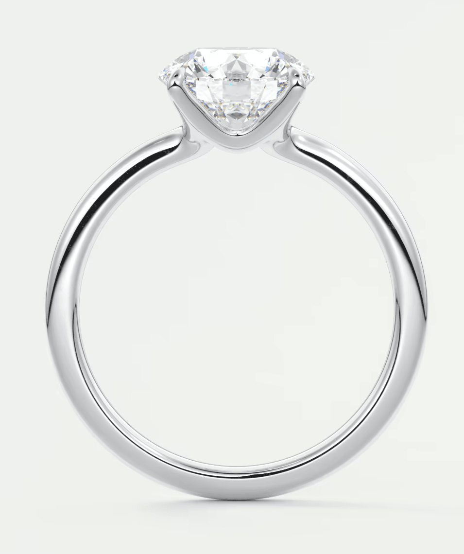 18-karat white gold solitaire diamond engagement ring.