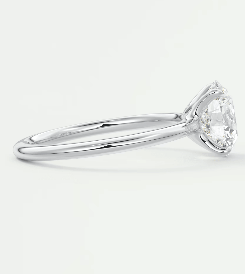 18-karat white gold engagement ring with a marquise-cut diamond.