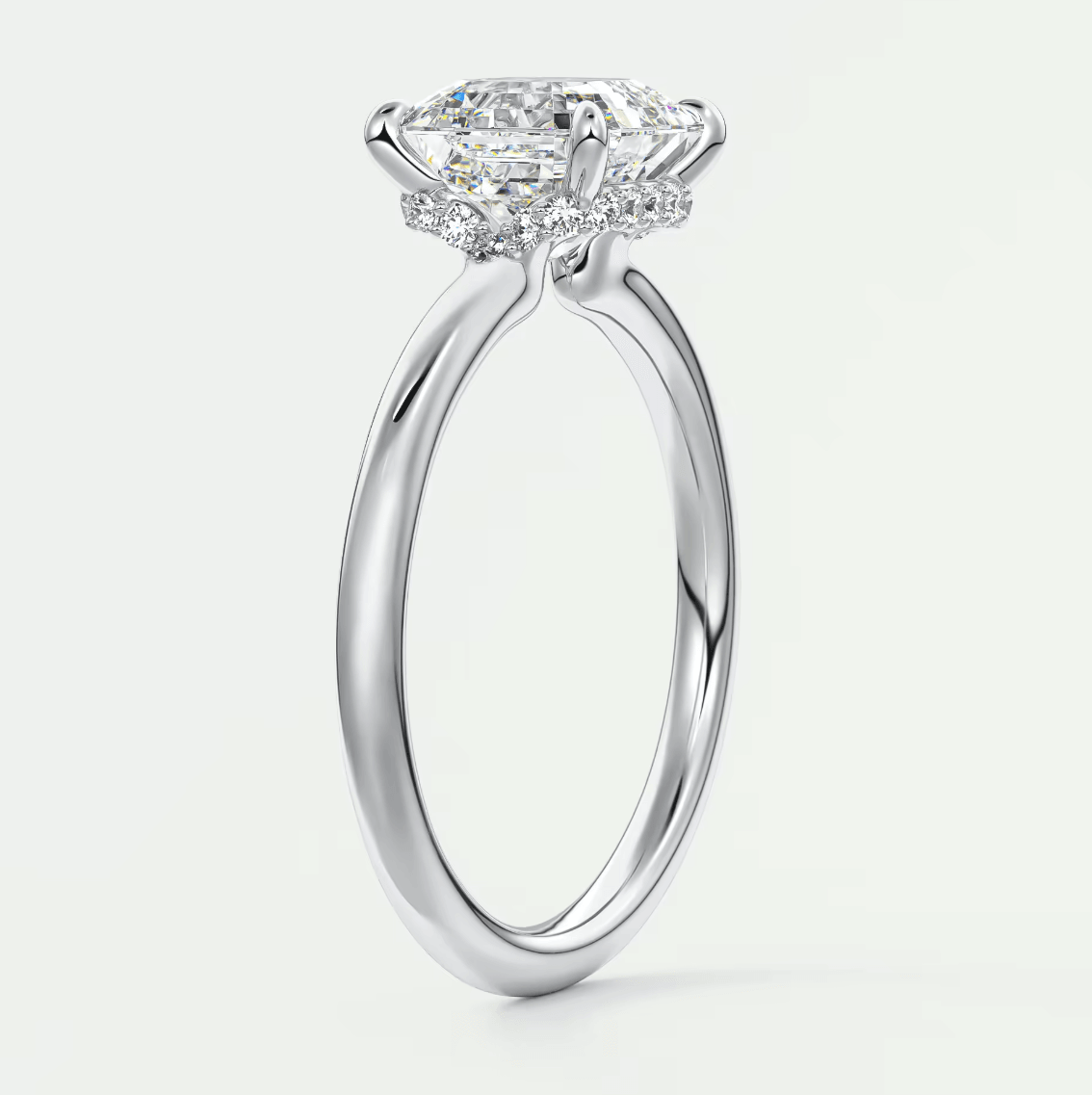 18-karat white gold engagement ring with a princess-cut diamond.