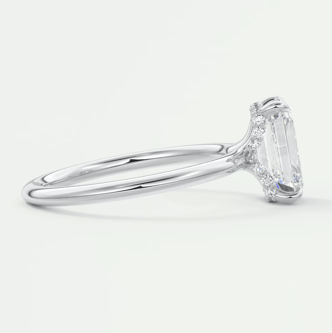 18k white gold emerald cut diamond engagement ring with a solitaire design.