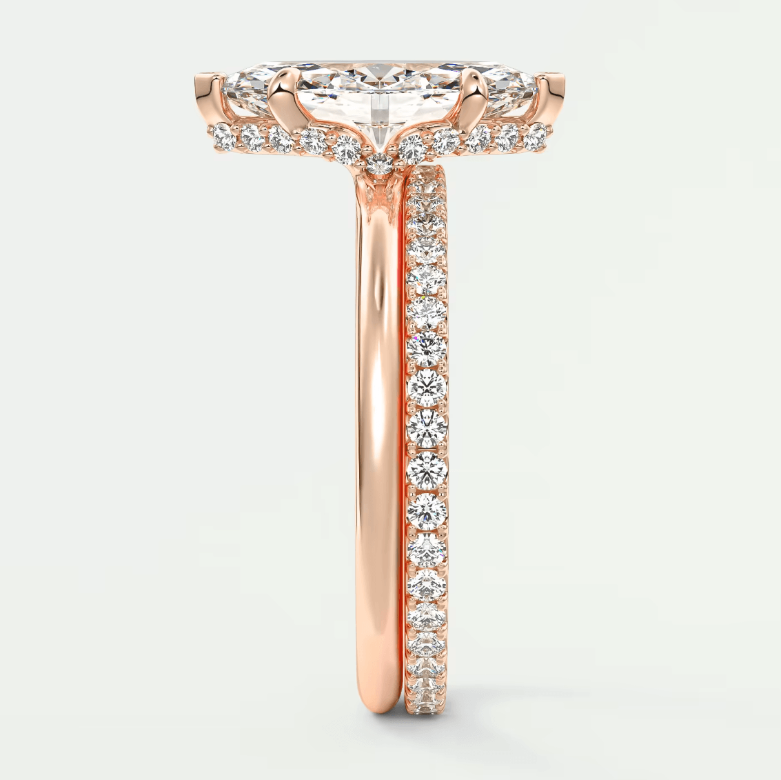 18k rose gold diamond engagement ring with a halo design.