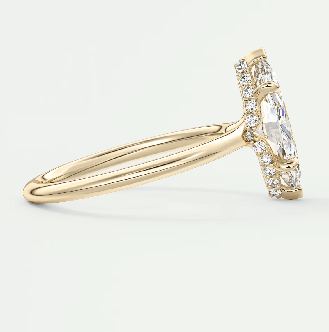 18k yellow gold engagement ring with a princess cut diamond and pave set diamonds on the band.