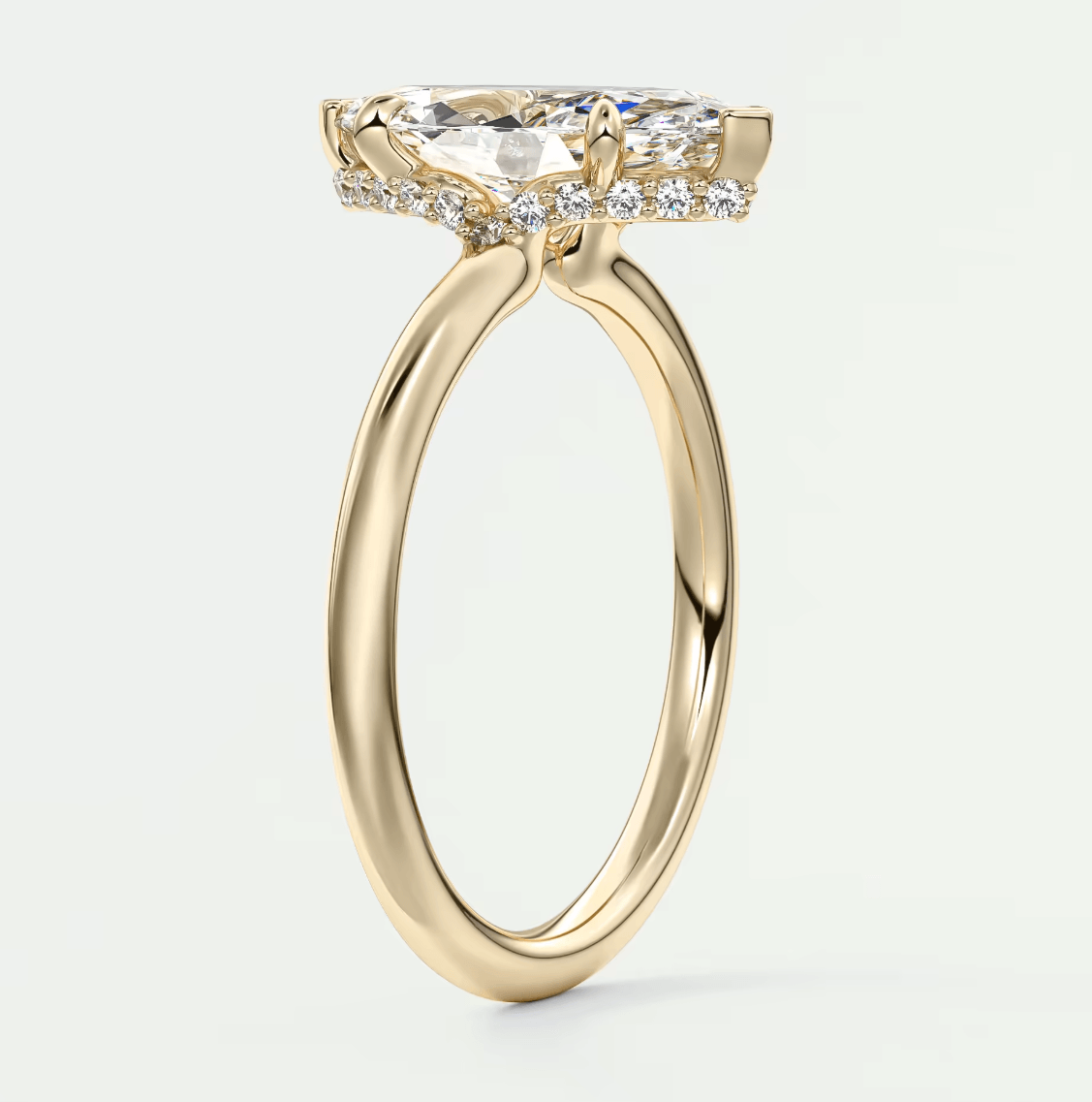18k yellow gold engagement ring with a princess cut diamond and halo setting.