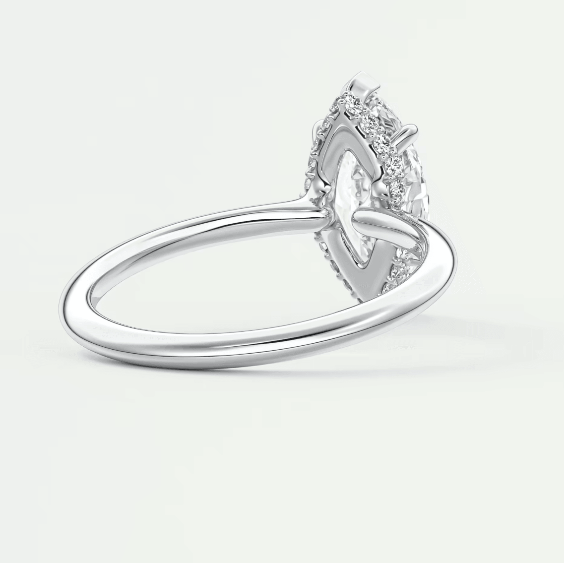 18k white gold diamond engagement ring with a heart-shaped halo.