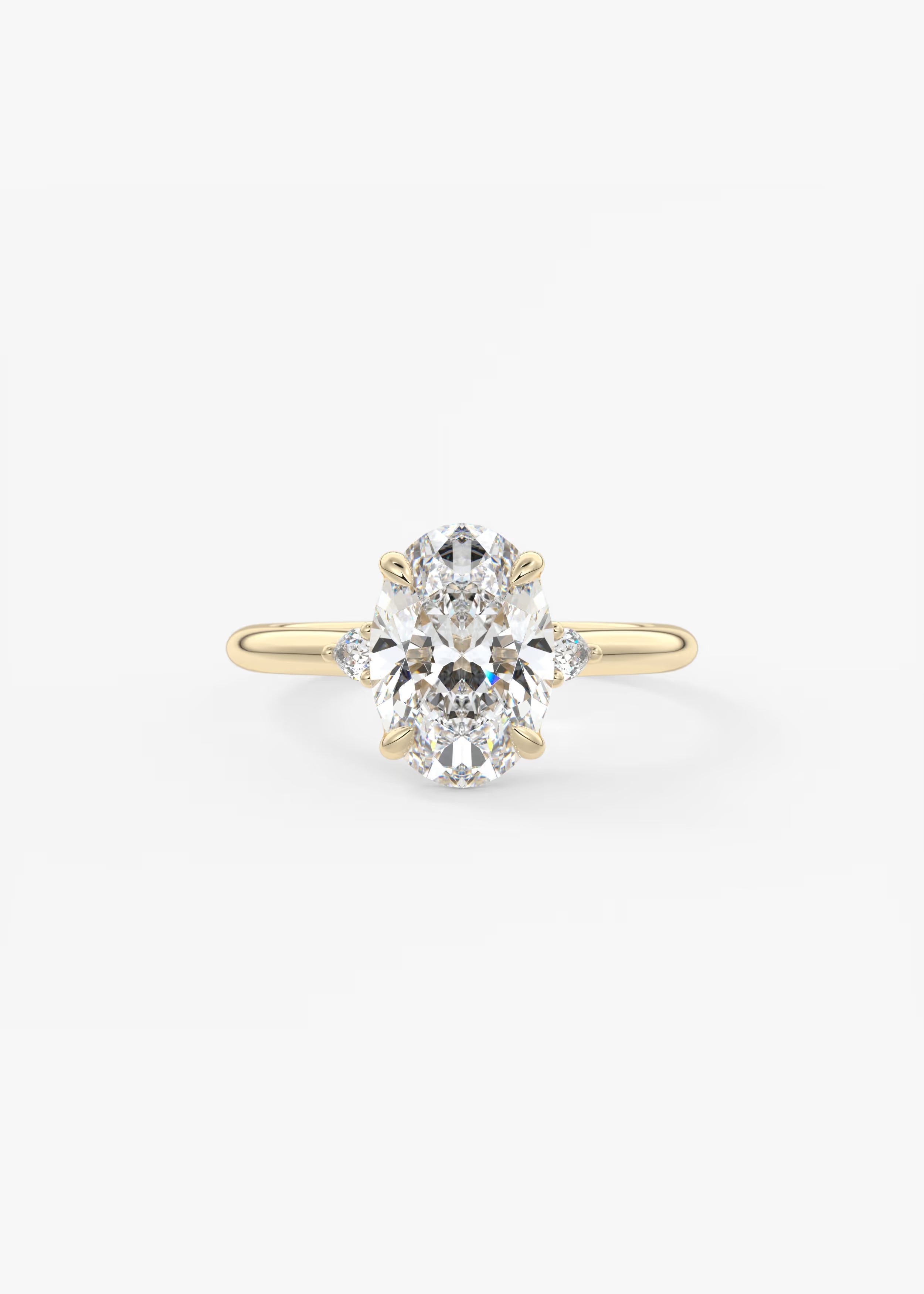 Cassia – Oval Trilogy with Pear Side Stones