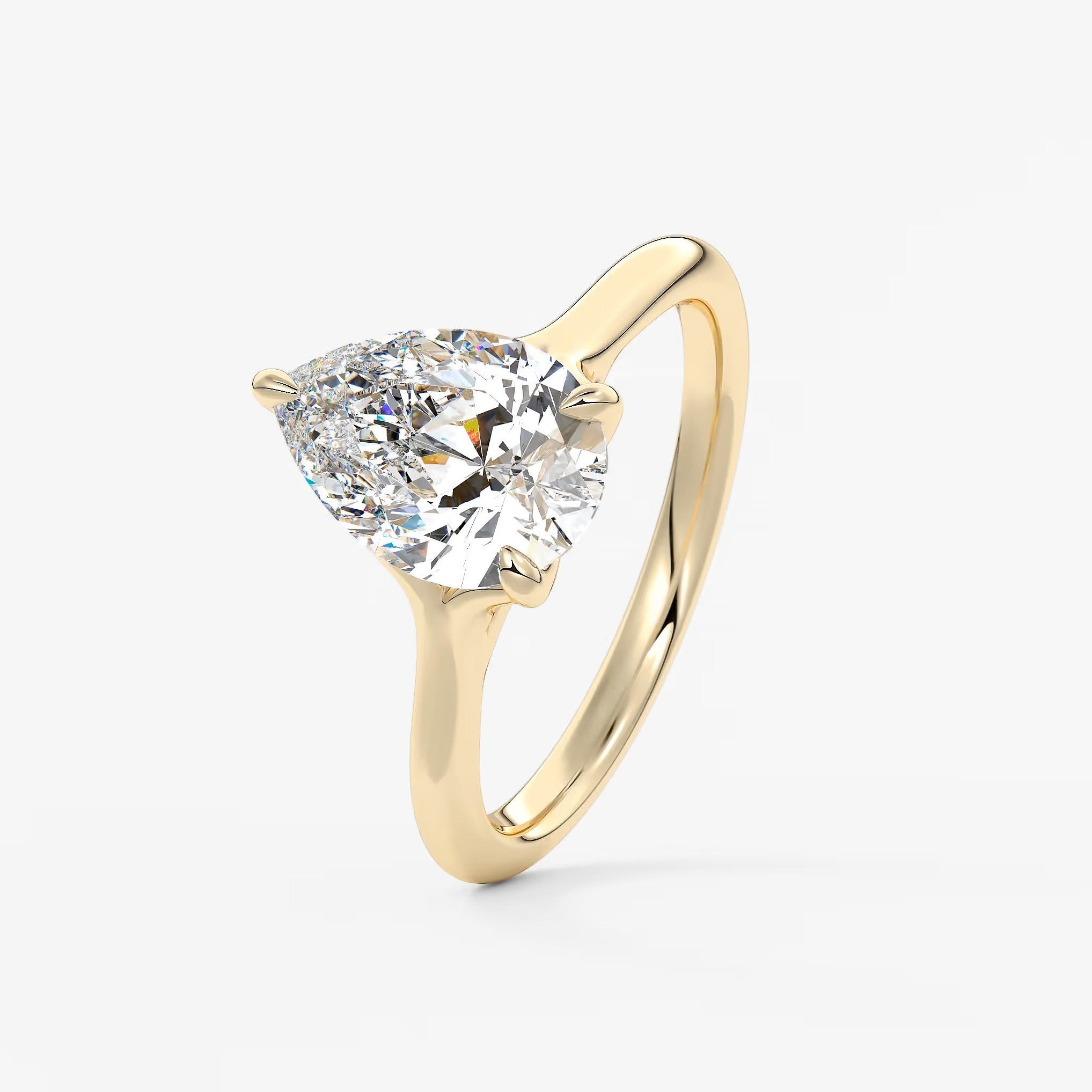 Cassia – pear solitaire with triple-claw prongs