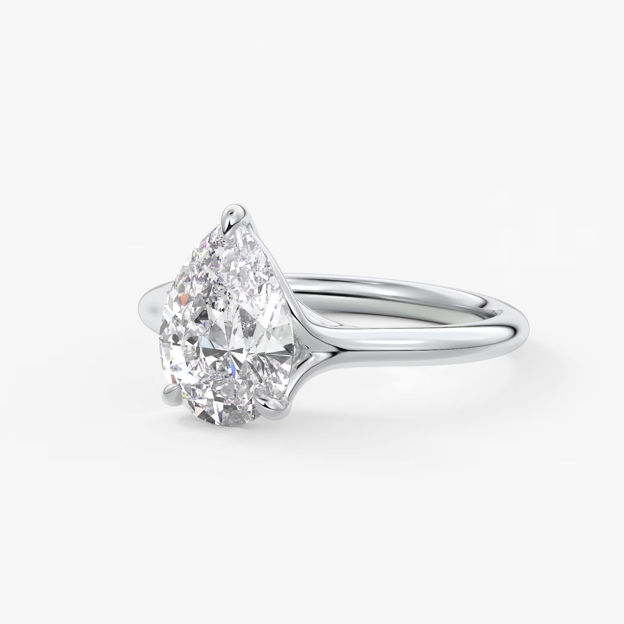 Cassia – pear solitaire with triple-claw prongs