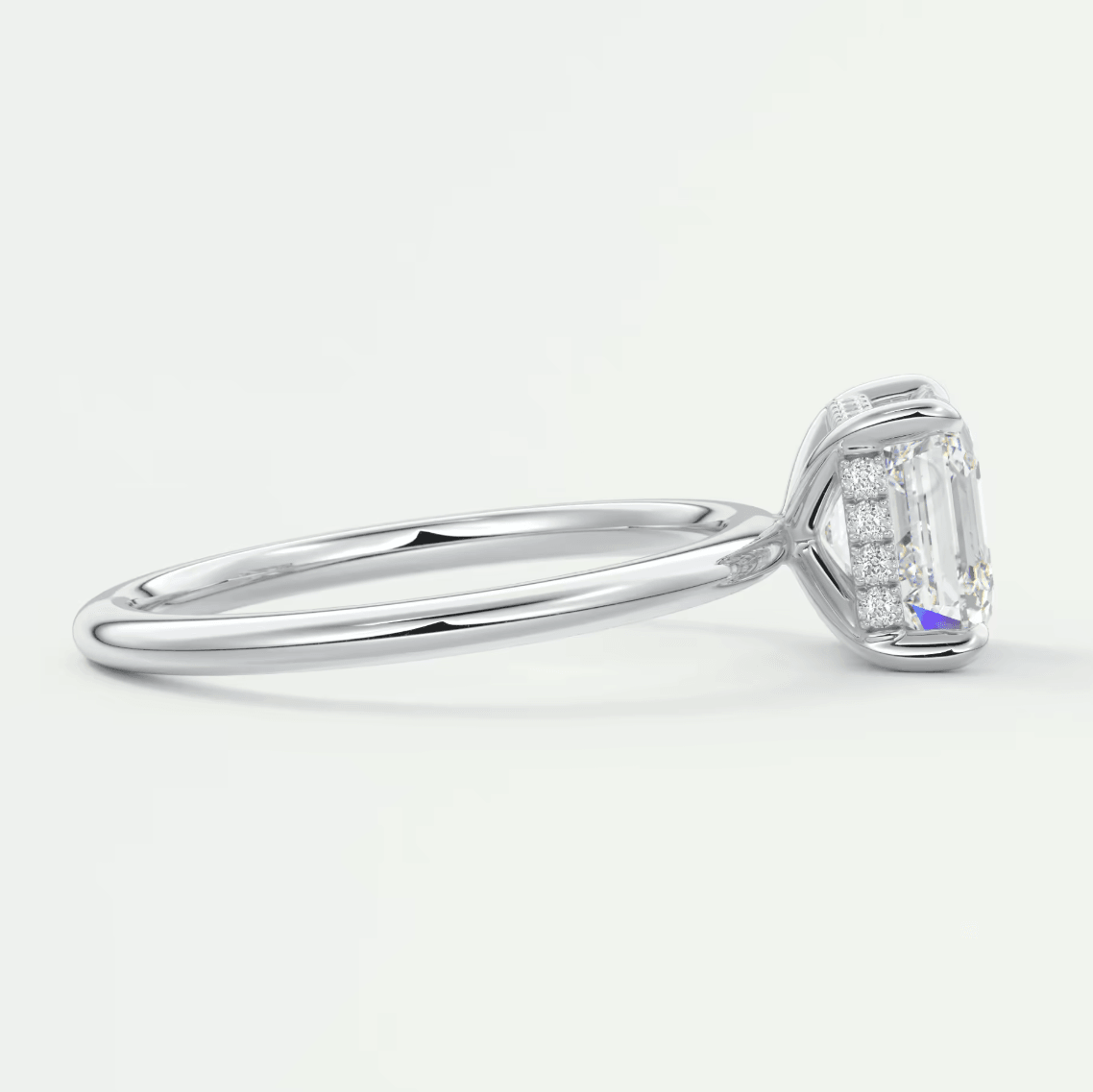 18k white gold emerald cut diamond engagement ring with a halo design.