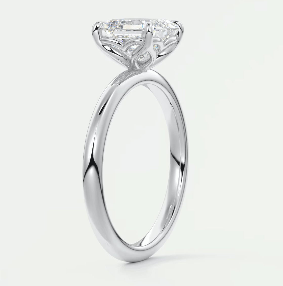 18k white gold engagement ring with a princess cut diamond.