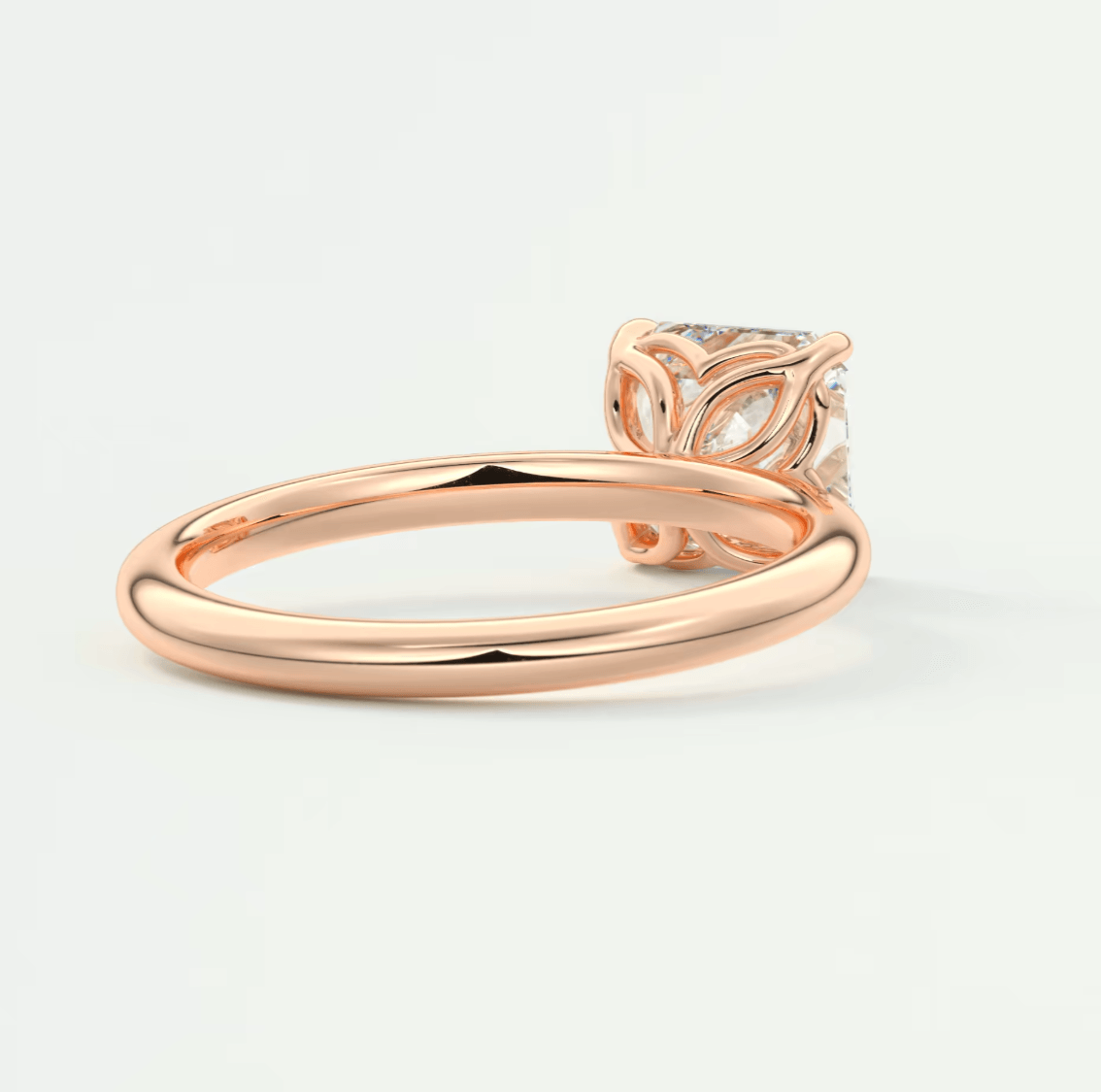 Rose gold diamond engagement ring with floral setting and polished finish.
