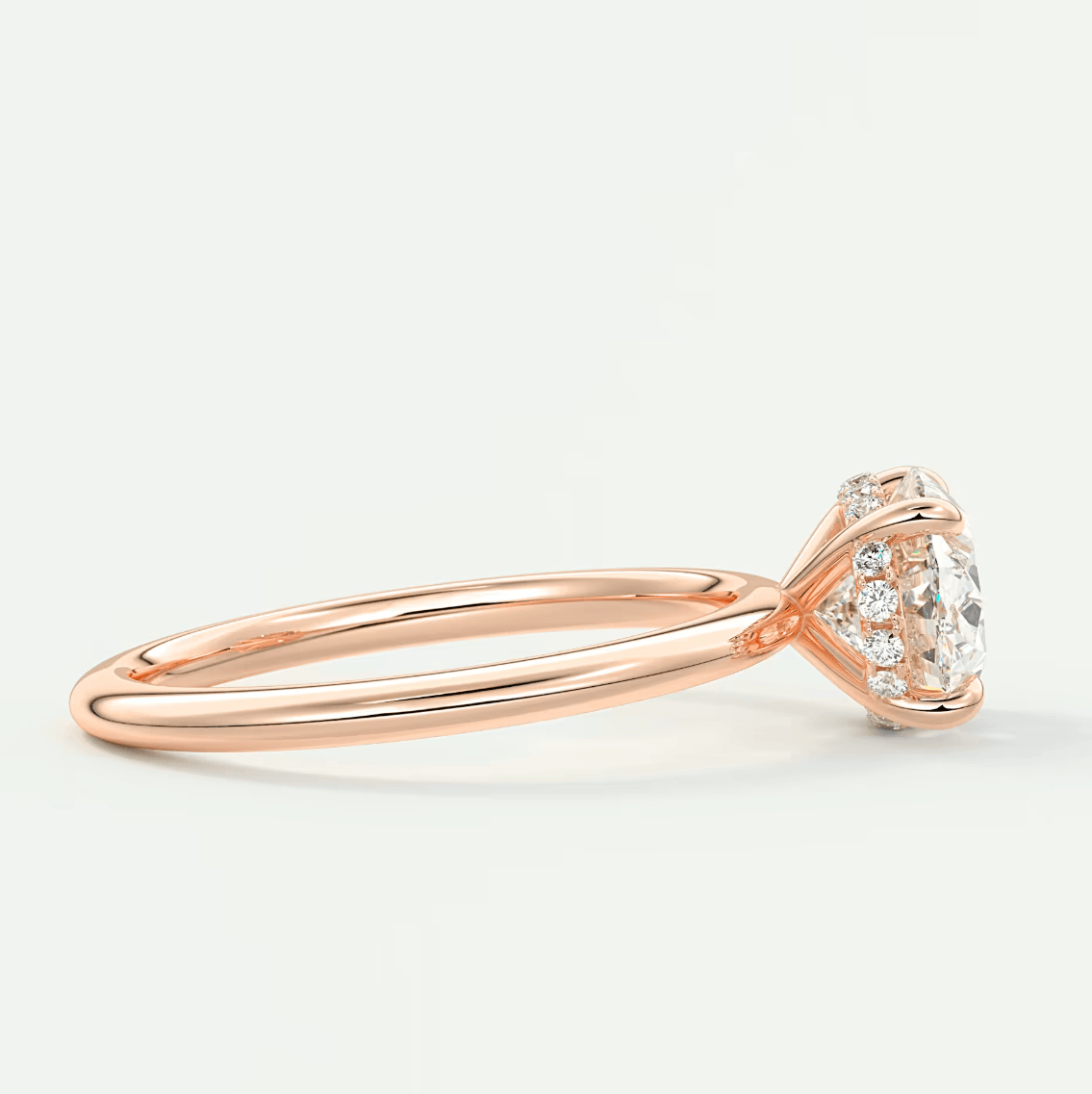 18k rose gold diamond engagement ring with a solitaire design.
