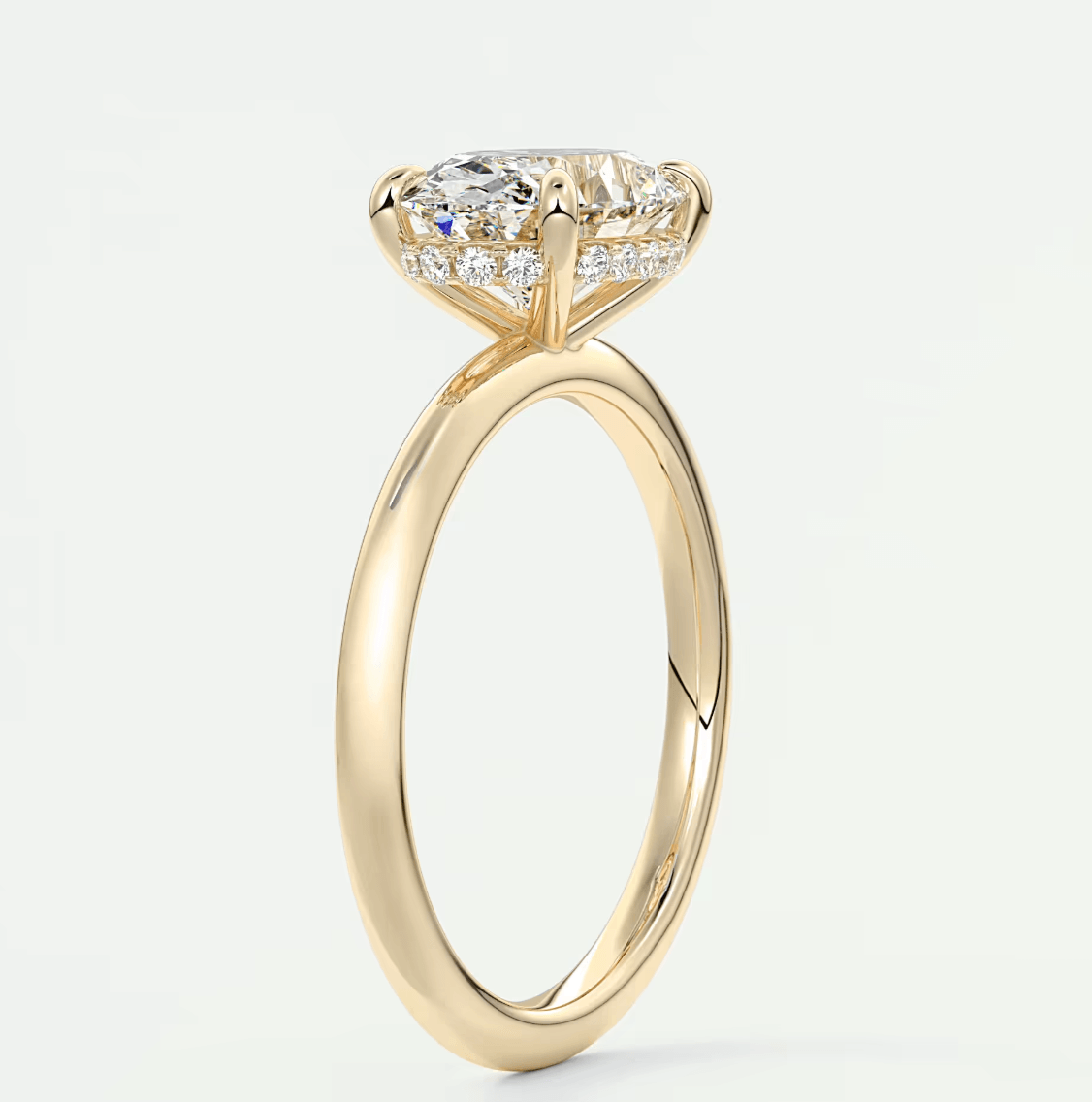 18k yellow gold engagement ring with a princess cut diamond and small side stones.