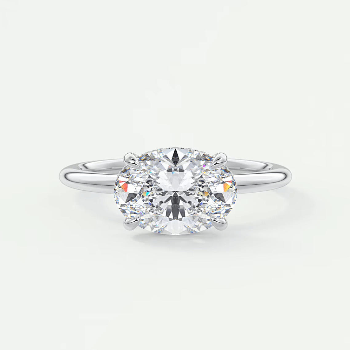 18-karat white gold engagement ring with a round diamond.