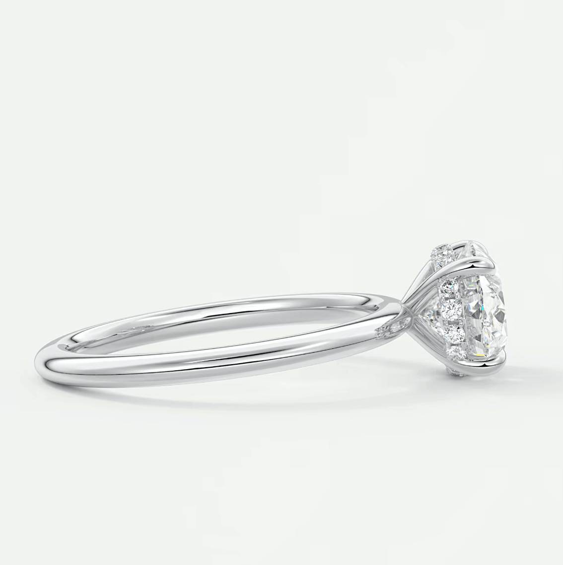 18-karat white gold diamond engagement ring with a pear-shaped center stone.