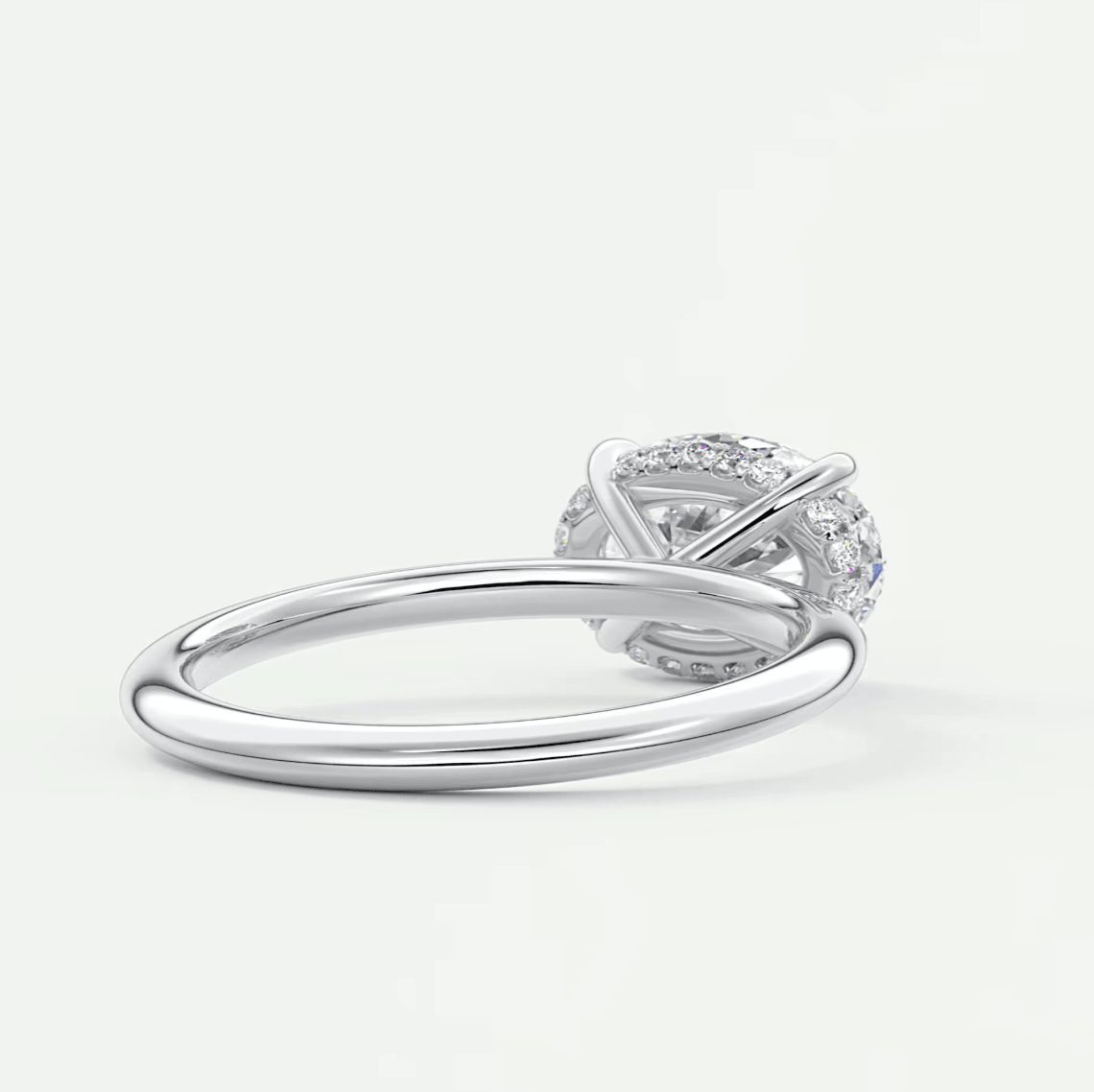 18k white gold diamond engagement ring with a princess cut center stone and halo of smaller diamonds.