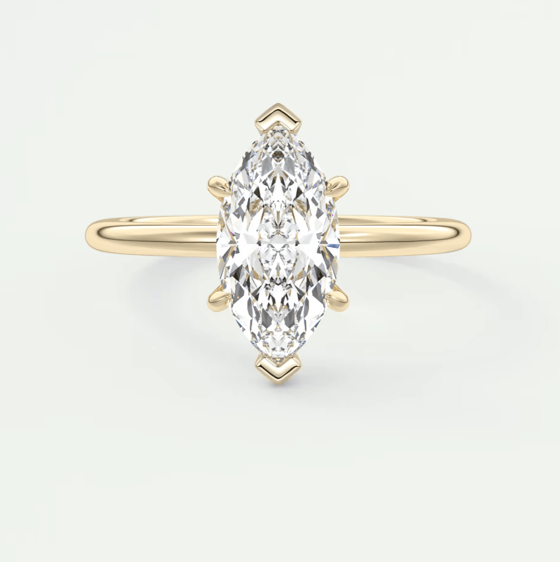 18k yellow gold marquise diamond engagement ring with a classic solitaire design.