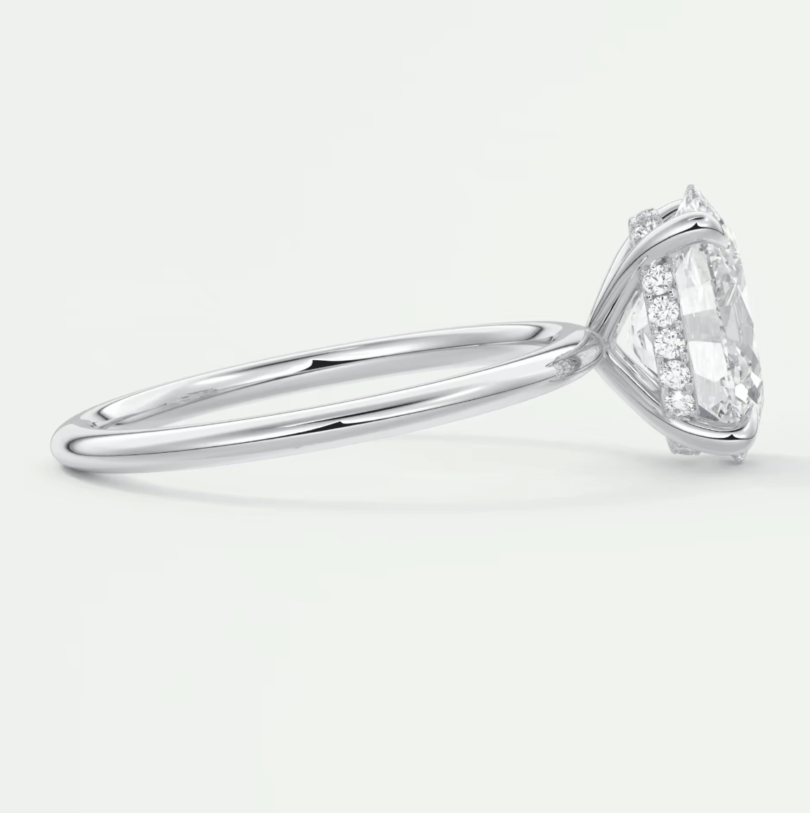 18k white gold engagement ring with a marquise-cut diamond.