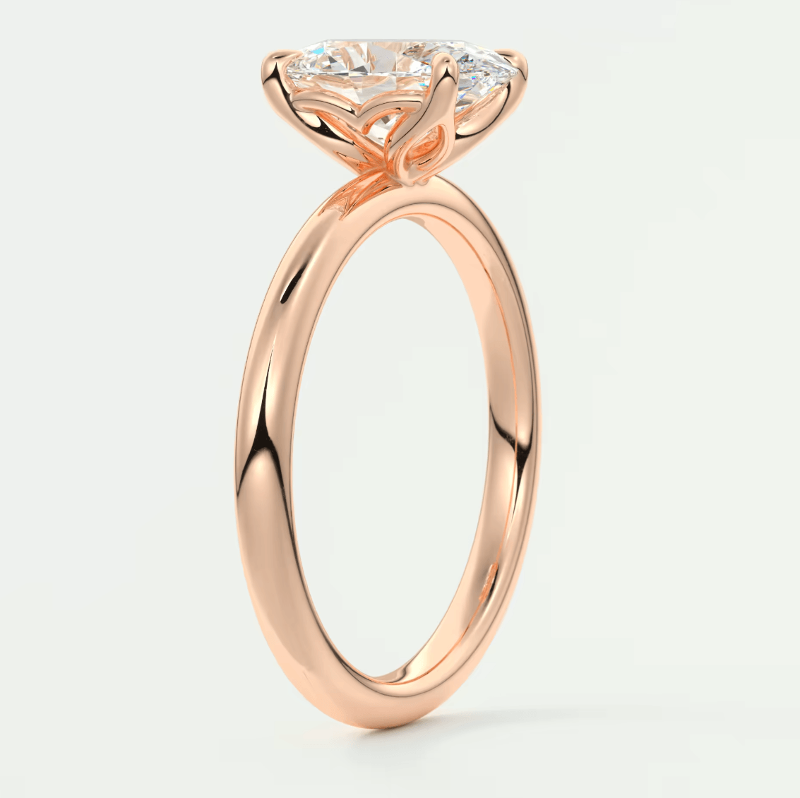 18k rose gold engagement ring with a princess cut diamond.