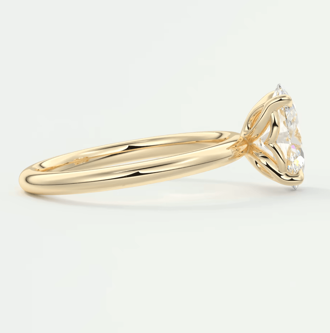 18k yellow gold engagement ring with a princess cut diamond.