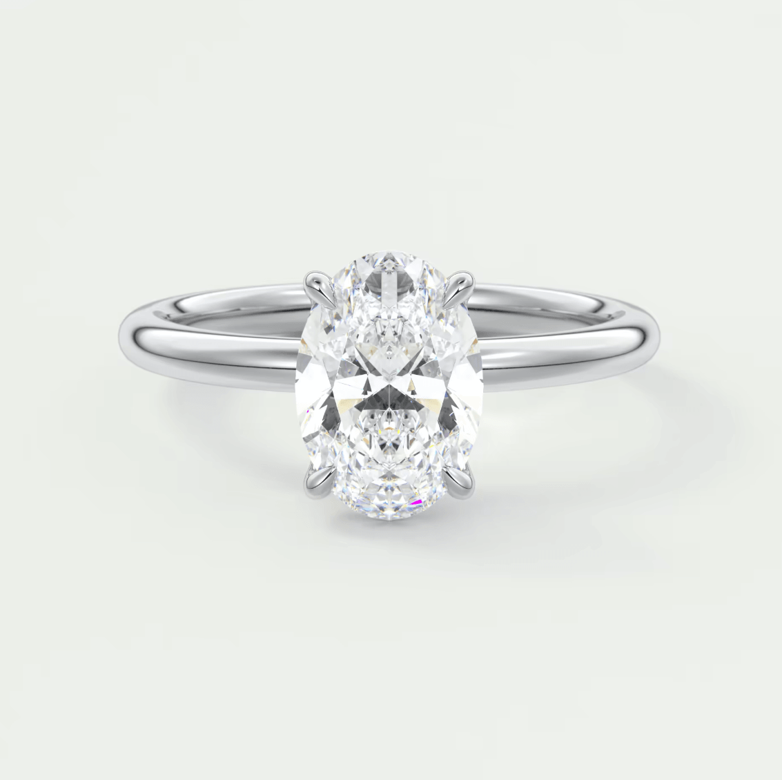 18k white gold oval diamond engagement ring with a solitaire design.