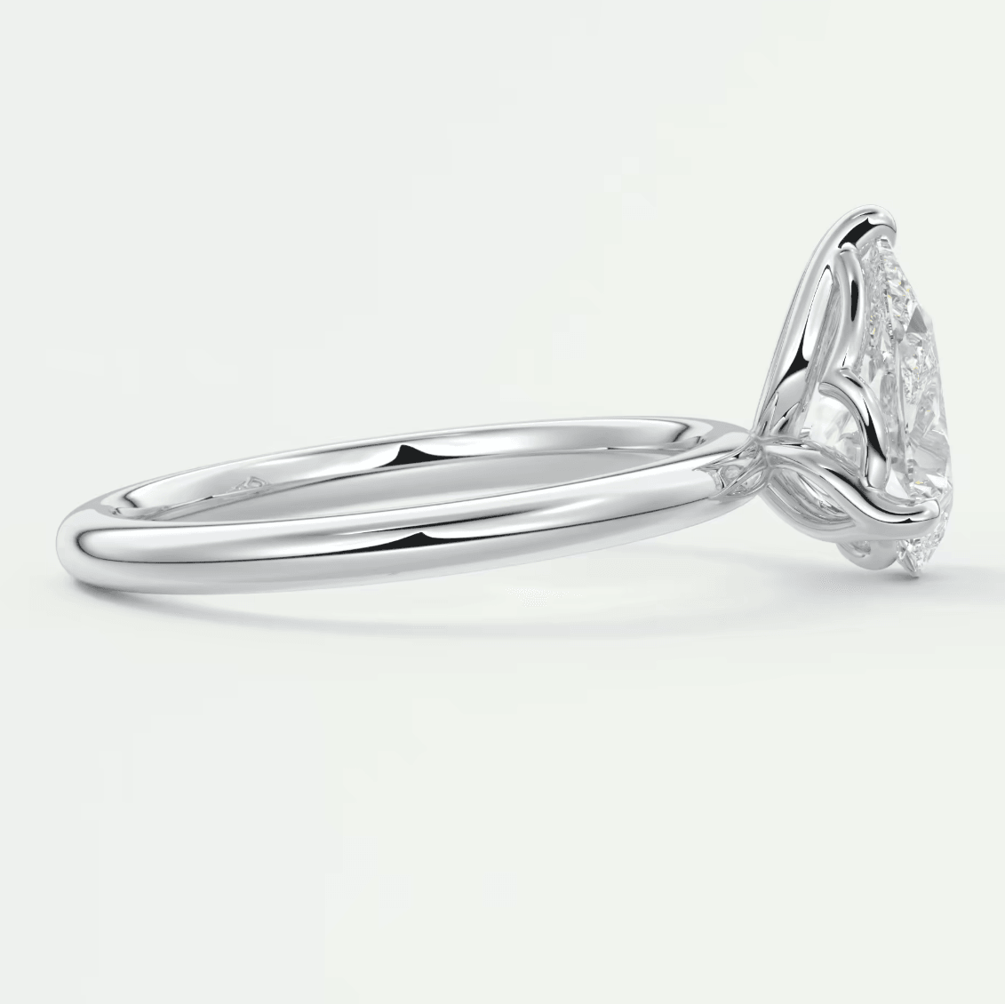 18k white gold engagement ring with a cushion-cut diamond.