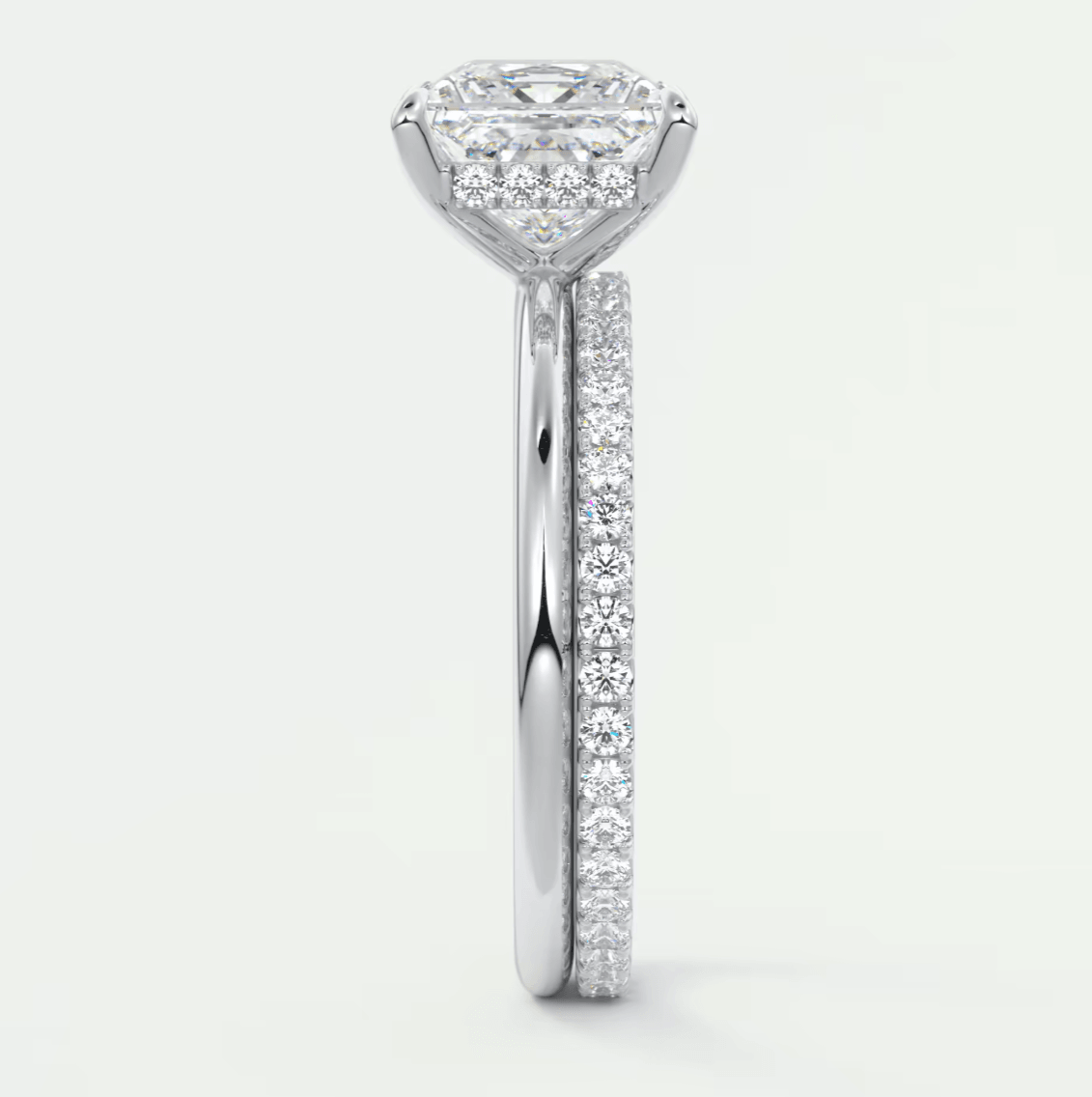 18k white gold diamond engagement ring with a marquise-cut center stone and pave-set diamonds on the band.