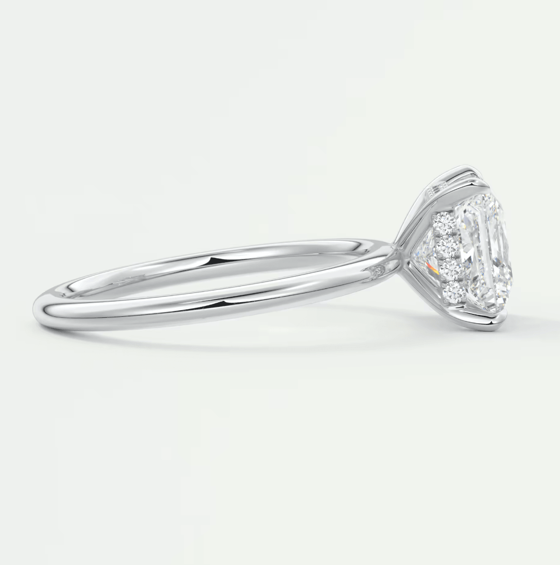 18-karat white gold engagement ring with a cushion-cut diamond.