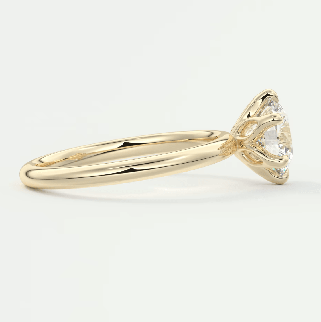 18k yellow gold engagement ring with a round diamond.