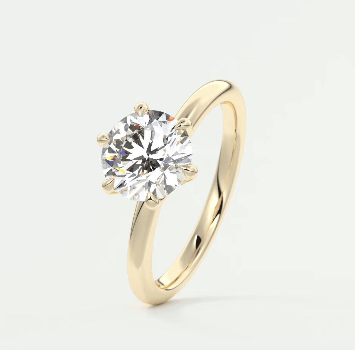 18k yellow gold solitaire diamond engagement ring.