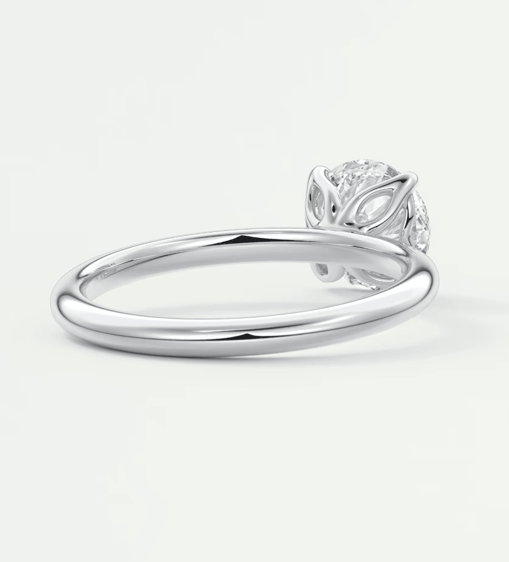 18k white gold diamond engagement ring with leaf design.