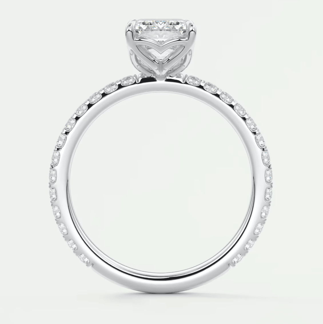 18k white gold engagement ring with a princess cut diamond and pavé set diamonds on the band.