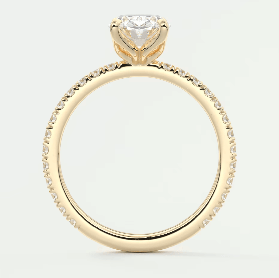 18k yellow gold engagement ring with a princess cut diamond and pavé set diamonds on the band.